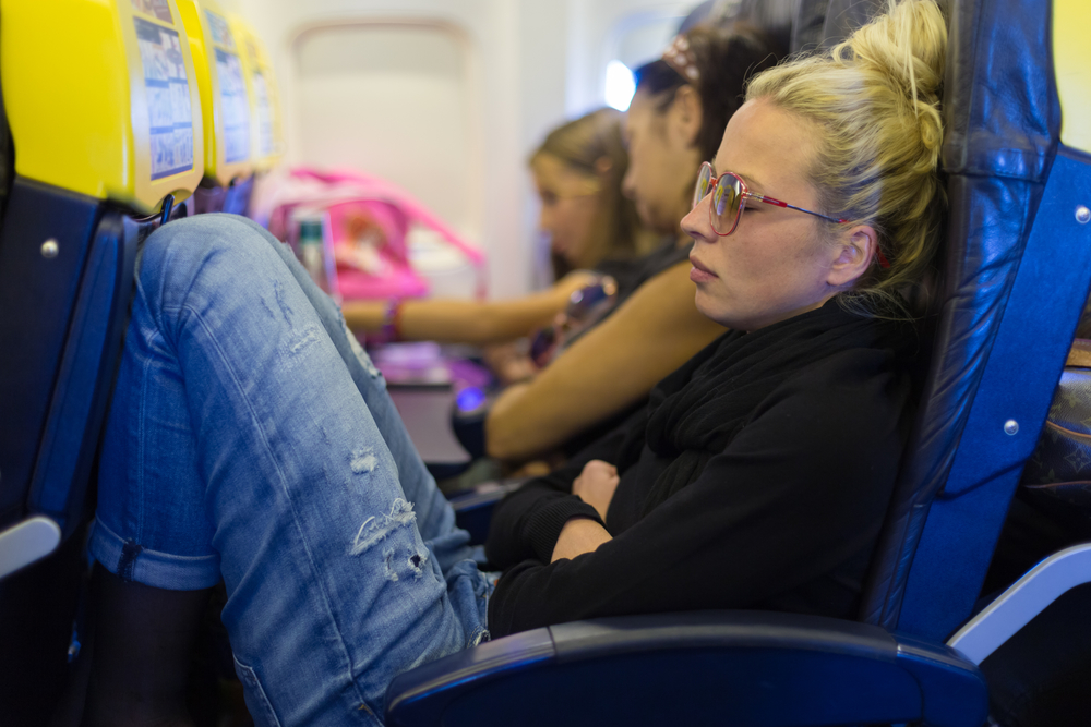 Life-threatening blood clots and flying have been linked for more than  50 years, but a new study of business travelers confirms the  risk, particularly for those who take long flights or fly frequently. But while it is often referred to as “economy-class syndrome” because of the cramped seating there, D.V.T. also occurs among those who fly in business class and first class, the researchers found. D.V.T. occurs when a blood clot forms within the large deep veins of the body, usually in the leg. If untreated, part of the clot may break off and travel to the lungs, where it can cause a pulmonary embolism, a potentially fatal condition. Frits R. Rosendaal and Suzanne C. Cannegieter of Leiden University Medical Center in the Netherlands, the study’s lead researchers, tracked almost 9,000 employees of large international companies and organizations over a four-  or five-year period, in what they call the most comprehensive study of its kind to date. The results were published  this fall in the online journal PLoS Medicine; preliminary findings were reported in late June by the World Health Organization. “We now know out of 4,500 people who fly, one will get a D.V.T. within eight weeks after travel,”  Dr. Cannegieter said. “It’s not really a huge amount,” but, she said, the risk increases with the duration of a flight and the number of flights in a short period. Obesity,  a person’s stature,  oral contraceptive use, hormone replacement therapy and inherited blood clotting disorders also increase risk. Rob Donnelly, vice president for health at Royal Dutch Shell,  which participated in the study, said the company uses a Web-based tracking system that helps identify at-risk employees. That allows  the company to take additional measures if necessary. Employees log onto the company’s intranet for training about risks, symptoms and preventive measurers for D.V.T. (and other conditions or diseases). Several years ago, Michael G. Reiff, an American executive with Royal Dutch Shell, was  hospitalized with life-threatening blood clots on his lungs after a flight from Houston to Amsterdam. Mr. Reiff, 53, who is head of global compensation and benefits, took long  flights almost 50 percent of the time when traveling. He always flew first class or business class. He has since cut his flying time almost in half and no longer sleeps on planes. “Now I literally walk up and down the aisles.” At work, “I walk the halls every two hours, even at meetings,” Mr. Reiff said. Rochelle Broome, corporate medical director for primary care at CHD Meridian Healthcare, which operates 231 on-site health care centers for 105 corporate clients, said that in addition to walking, she recommends that employees do frequent seat exercises to ensure increased blood circulation. Many airlines provide examples in flight magazines or in-cabin videos. About three years ago, CHD Meridian began a series of initiatives on D.V.T. prevention that includes briefings during one-on-one travel consultations and routine exams, informational materials and a yearly D.V.T. awareness month. D.V.T. typically includes unexplained pain, tenderness, redness and swelling, often in the leg. Once a clot has traveled to the lung, common symptoms include chest pain and breathing difficulties. But diagnosis can be difficult. Some cases are asymptomatic or can mirror other illnesses. Leg pain can be mistaken for an athletic injury or strained muscle. Chest pain is often diagnosed as a heart attack or the flu. When Randy Fenninger, 60, president of MARC Associates, a lobbying firm in Washington, entered an emergency room with chest pain, he was not properly diagnosed until almost seven hours later. “My experience is not at all unique,” said Mr. Fenninger, who is  president of the National Alliance for Thrombosis and Thrombophilia, a nonprofit  health education group. He recommends that people who have recently been on a plane tell health care workers  and  check their family medical history. At the time, Mr. Fenninger did not know that he has a genetic clotting disorder that put him at higher risk. The alliance recently received cooperative agreements totaling more than  $1.3 million from the Centers for Disease Control and Prevention that is to  be used to increase public awareness. But overestimating the risk can lead to use of potentially dangerous precautions, Dr. Cannegieter said. “You try to prevent one problem, but create another one.” Aspirin is effective in preventing heart attacks and strokes, but not D.V.T. Aspirin and anticoagulant medicine, which also thins the blood, can cause uncontrolled bleeding. Luc Robyn, corporate medical adviser for Nestlé, which participated in the study, said in the past employees were tempted to take anticoagulants protectively. “But now that we know that absolute risk is not so high we can really tailor recommendations,” Dr. Robyn said. Anticoagulants are administered only if there is a pre-existing condition. The researchers also warn against wearing commercial compression stockings. They are only effective if custom fit; if not, they may cause harm by blocking blood flow. Excessive alcohol consumption or taking sleeping pills that promote immobility are discouraged. Lennart Dimberg, lead occupational health specialist at  the World Bank in Washington, which also participated in the study, said his organization has a policy stipulating that when travel requires nine or more hours of flying time, staff members may take a one-day rest stop in each direction to recuperate before working. “There is some evidence that the low air pressure in a plane affects the complex coagulation system of the blood,” Dr. Rosendaal said. When oxygen level goes down, the body may behave as if it is losing blood, making clot formation more likely. During sleep, less oxygen is taken in, another reason that sedatives are strongly discouraged. A version of this article appears in print on , on Page C5 of the New York edition  with the headline: Flying and Blood Clots: A Deadly Risk.   Order Reprints|    Today's Paper|  Subscribe